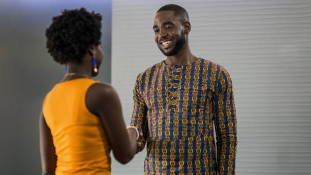 Two people greeting each other with a handshake