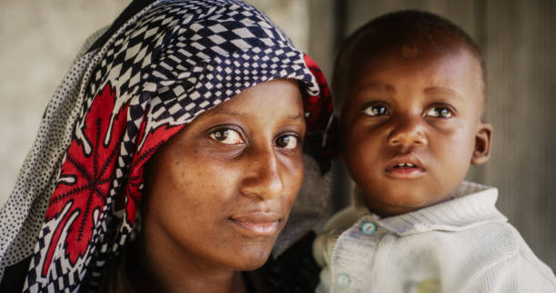 Mother holding her young child