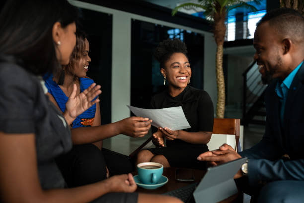 Colleagues sharing documents during a meeting
