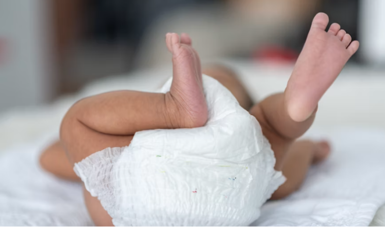 An Image of a Baby Wearing a Diaper.